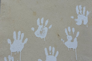 child's hand prints in blue paint 