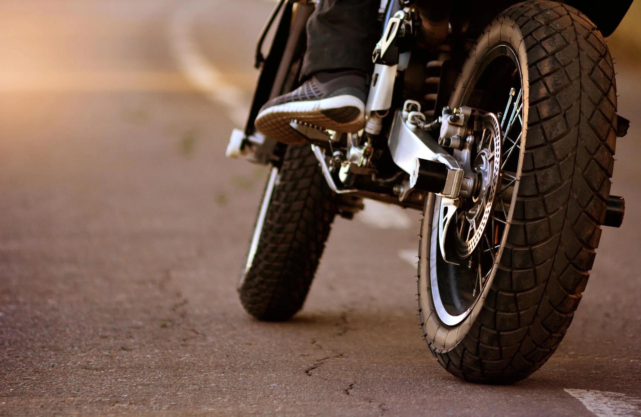 Man riding his motorcycle while following safety tips.