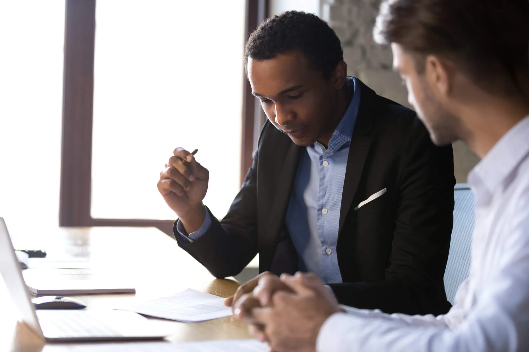 Client sitting with personal injury attorney