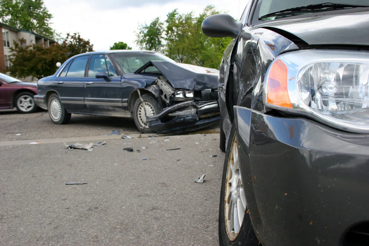 Two-car crash with heavy front-end and side damage