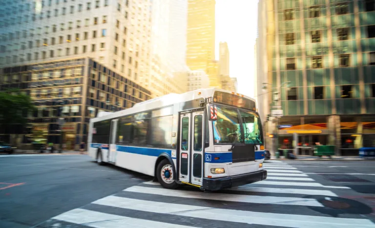 City transit bus turning through downtown intersection