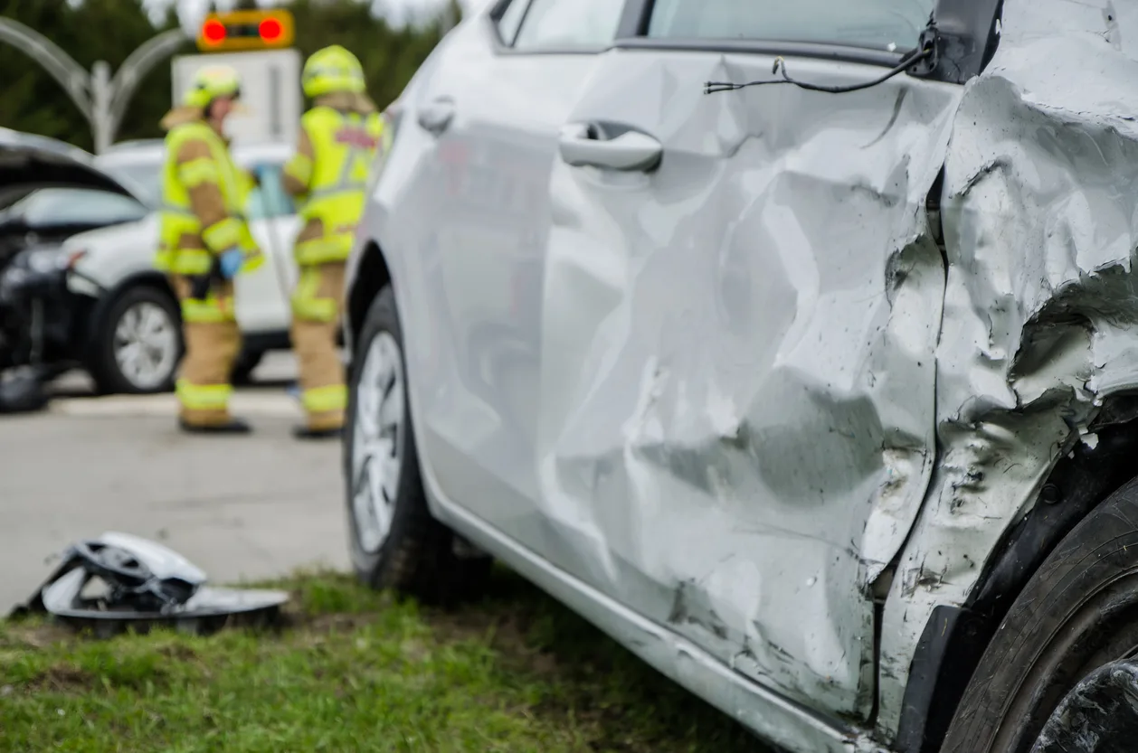 Side-impact car crash with crumpled door panel