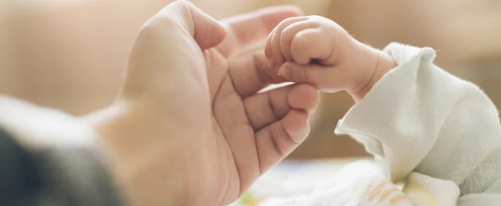 baby holding adults finger brachial plexus injury