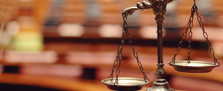 scales o justice with blurry background commercial litigation