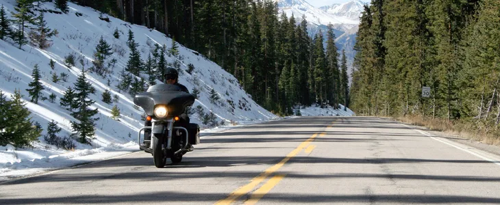person riding a motorcycle in the cold weather