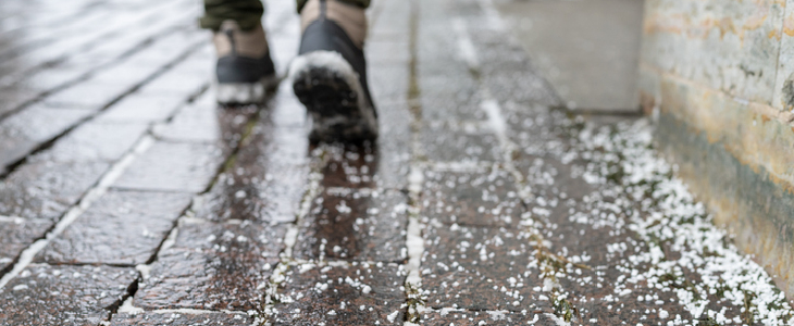 wet and icy cobblestone sidewalk