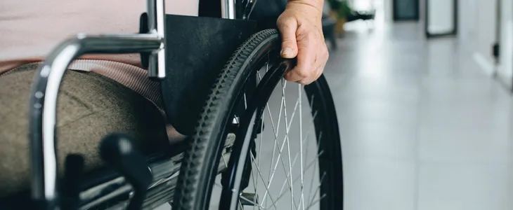 A man on a wheelchair who was affected by a major paralysis injury