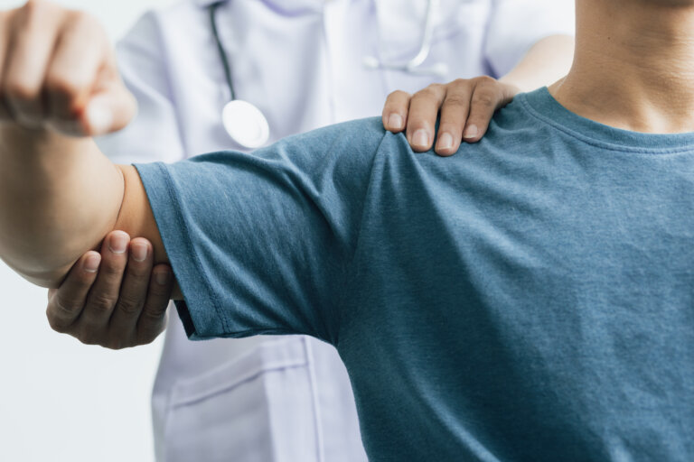 doctor holding patient's arm