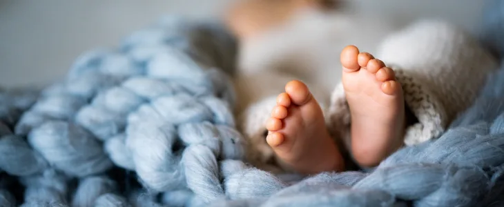Baby feet in a blanket