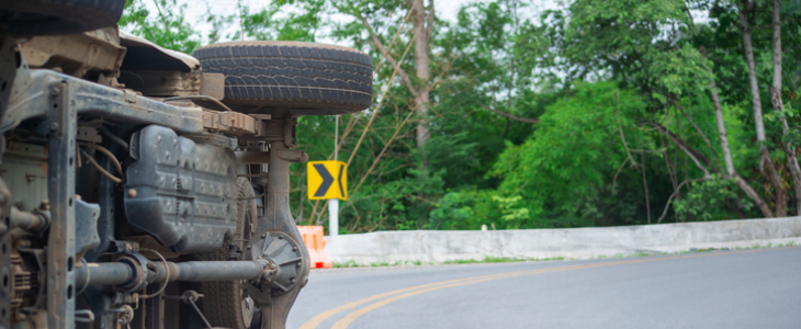 Car rolled over after a collision on the road