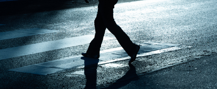 Woman walking across the street