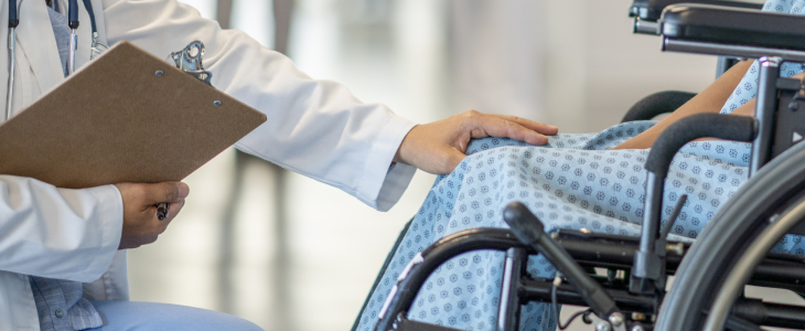 Doctor speaking with a patient in the hospital