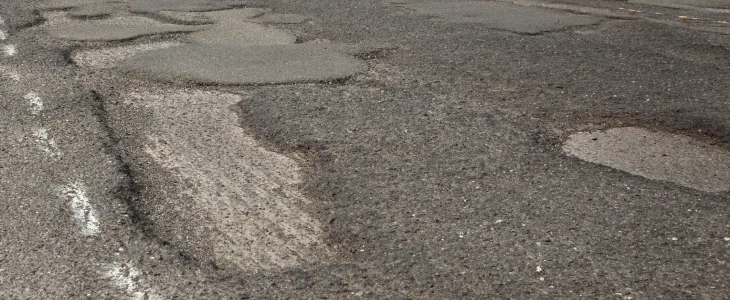 Potholes in the middle of a road