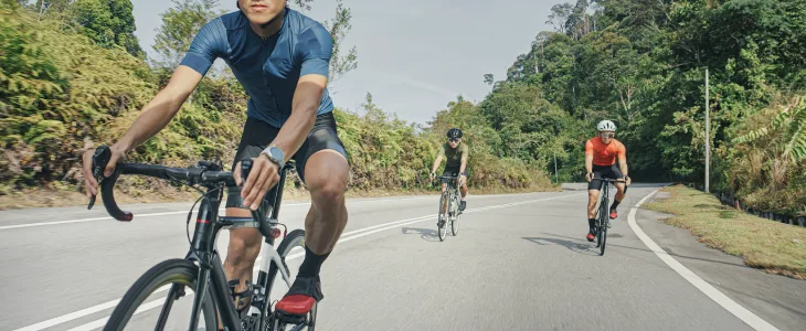 Cyclists riding in the middle of a road