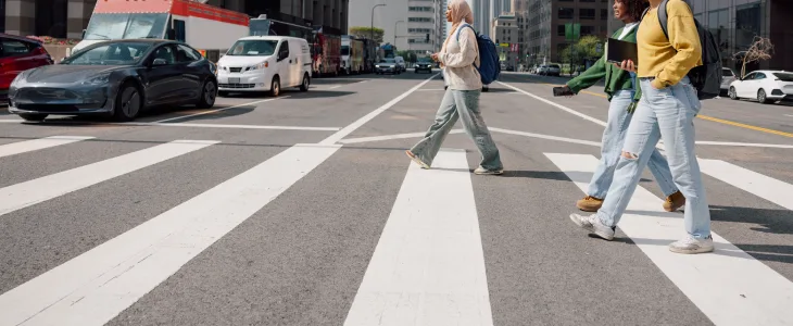 New Yorkers walking down a crosswalk