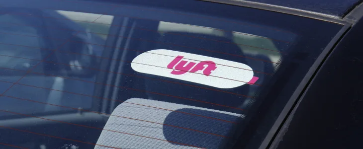 Lyft sticker on the top of a car
