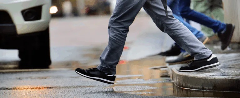 People walking across a crosswalk